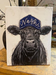 Black cow with a Nashville trucker hat