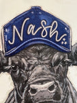 Black cow with a Nashville trucker hat