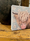 Highland cow blowing bubble canvas art print