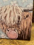 Highland cow blowing bubble canvas art print