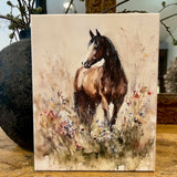 Horse in a field of flowers canvas art print