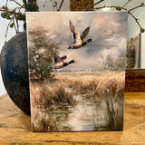Mallards flying canvas art print