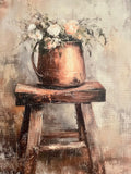 Florals in a copper pot on an old wooden stool