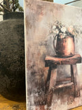 Florals in a copper pot on an old wooden stool