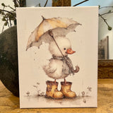 Cute duck with umbrella canvas art print