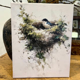 Bluebird perched in a nest canvas art print