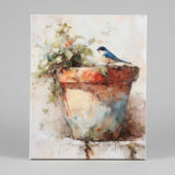 Bluebird perched on a clay pot canvas art print