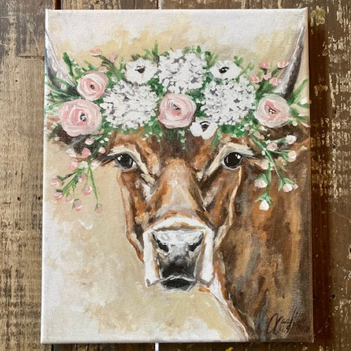 brown cow wearing pink and white flower halo canvas