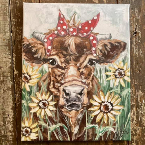 brown cow wearing a red and white polka dot bandana canvas art print
