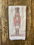 front view red and black christmas nutcracker hand towel